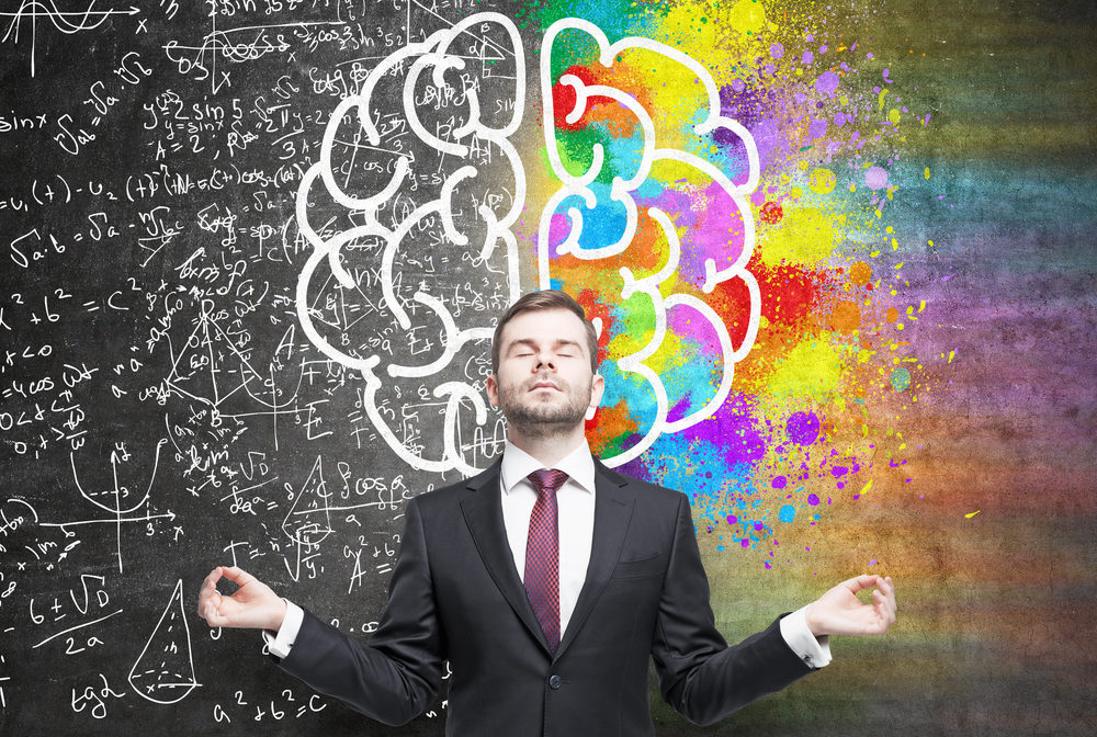 Man in a meditative pose showing both sides of the brain in the background.